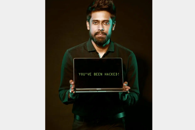 Free Man Holding Laptop Computer With Both Hands Stock Photo